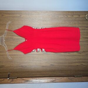 Red formal dress with side cut outs and rhinestones